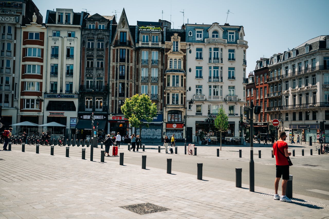 Vibrant cityscape of old town Lille, France, showcasing historic townhouses and lively urban atmosphere.